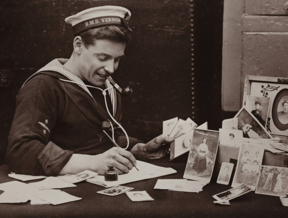 Old photograph of man writing letter